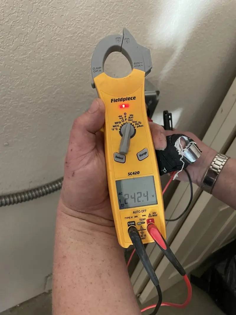 Voltage testing with clamp meter during Whole House Surge Protector in Homer